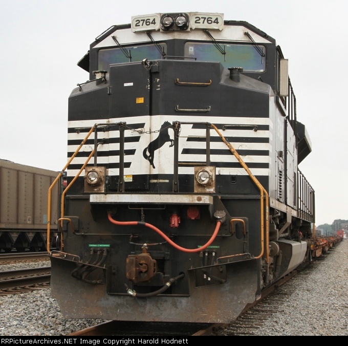 NS 2764 leads a work train in a siding